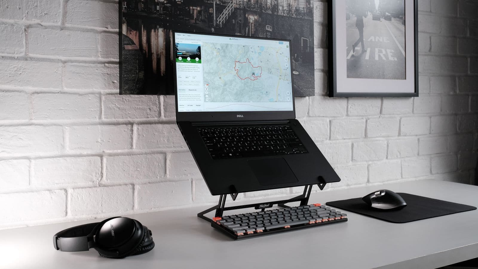 Modern desk with computer, chair, and ergonomic workspace accessories