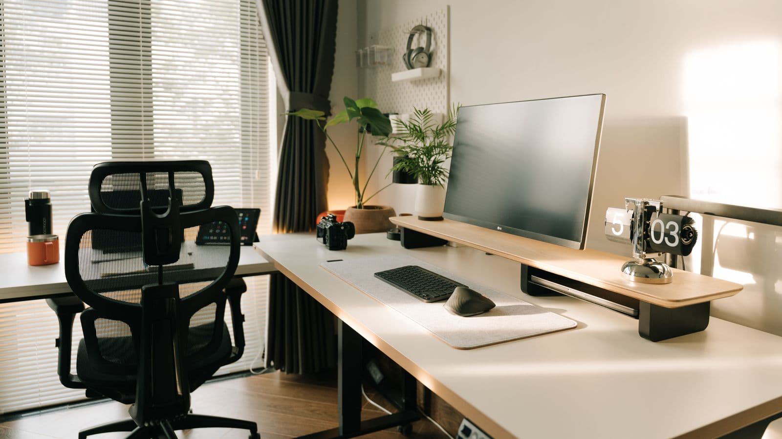 Modern desk with computer, chair, and ergonomic workspace accessories